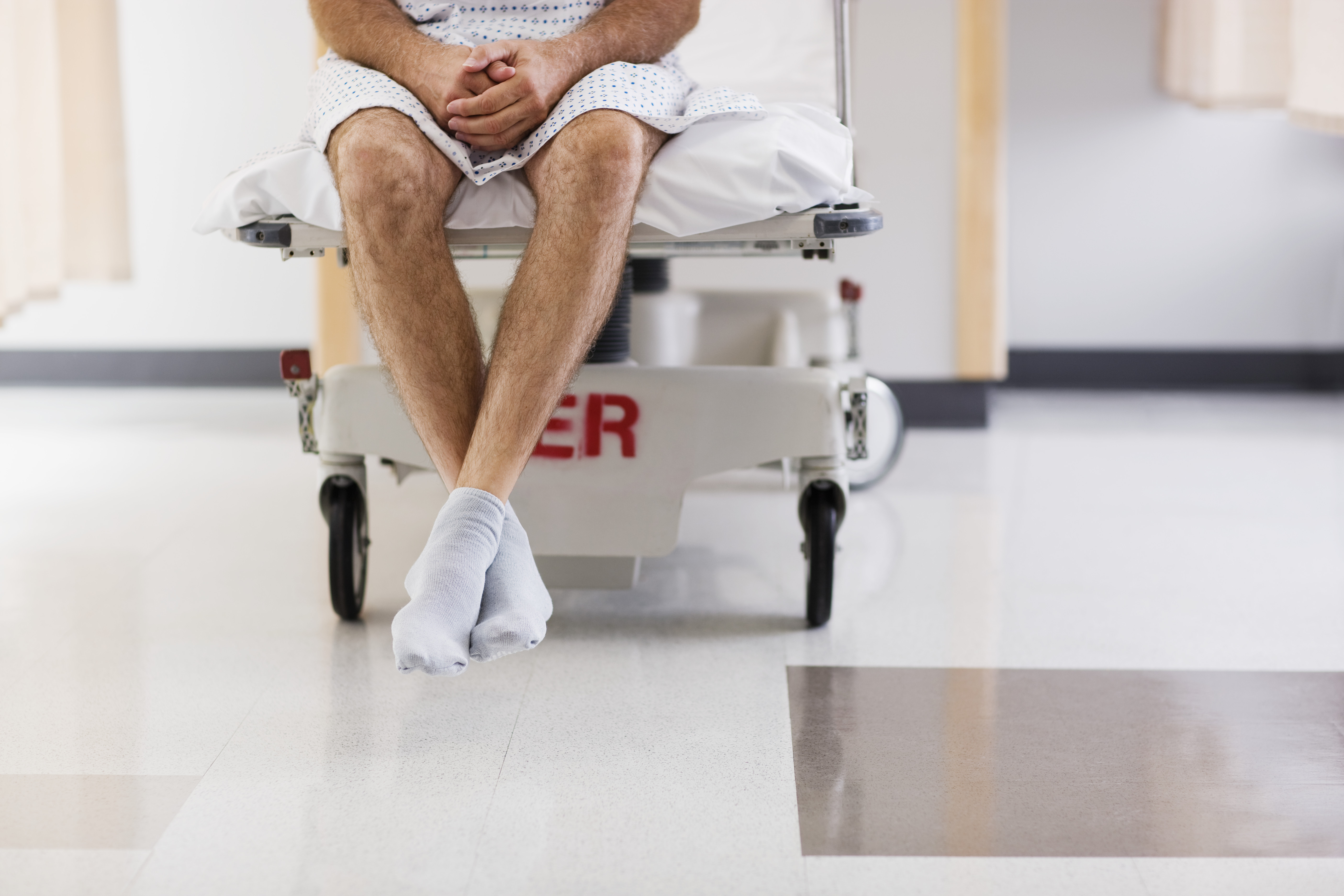 Patient Sitting on Hospital Bed
