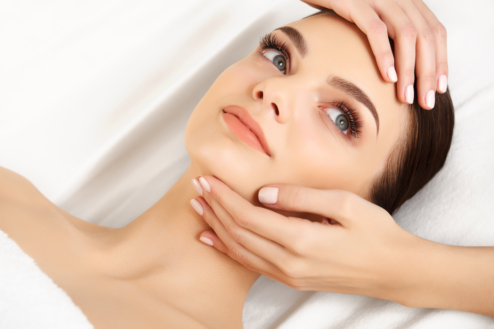 Face Massage. Close-up of a Young Woman Getting Spa Treatment.