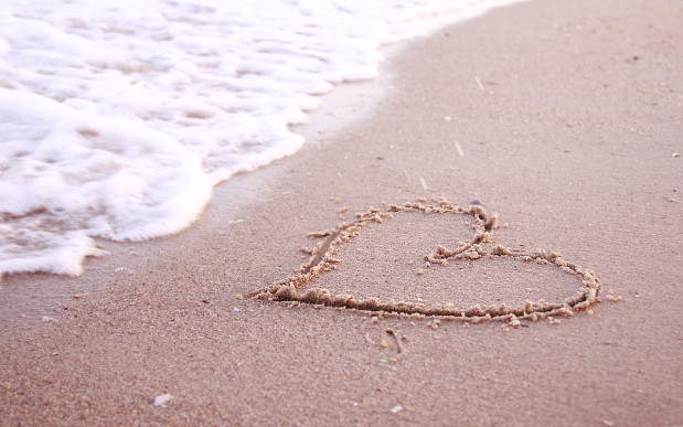 heart in the sand on the seashore