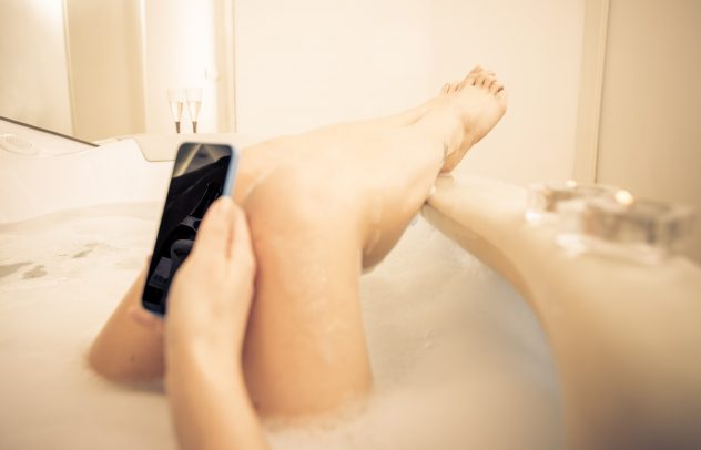 Woman legs in the tub